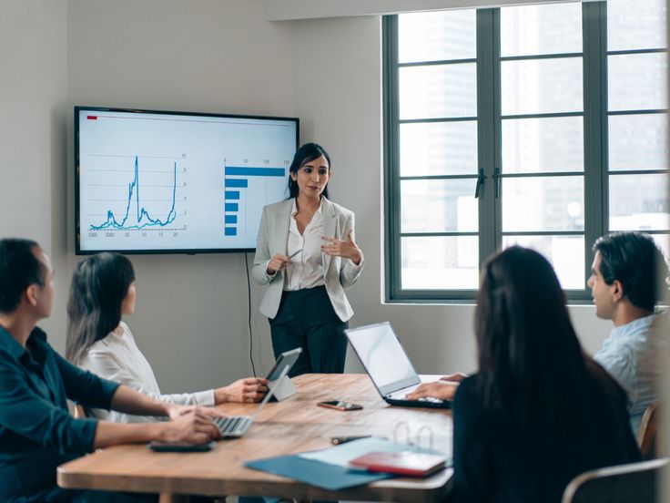 Leaders working together in a practical finance workshop